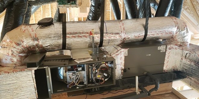 Technician repairing a home heating system